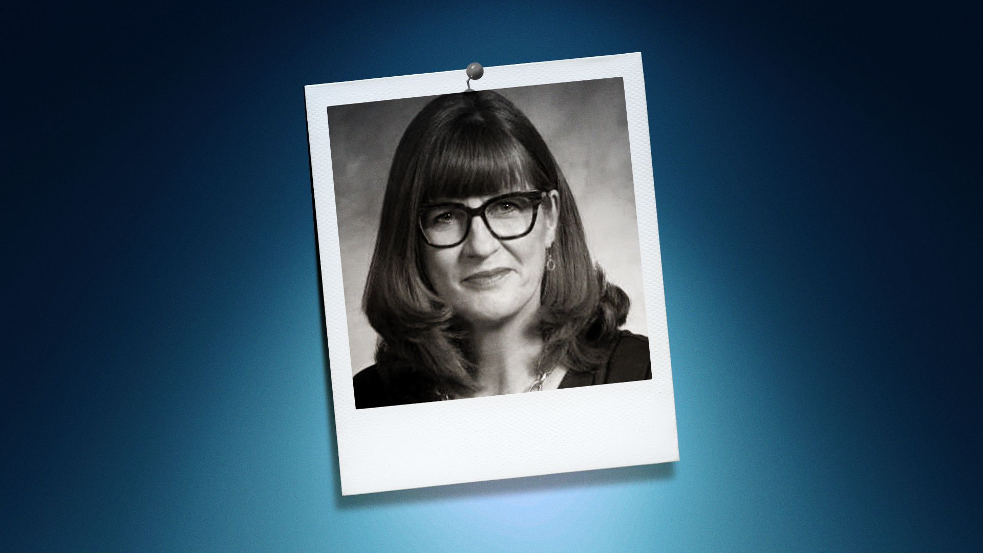 Photo illustration of Julie McCluskie in the center of a Polaroid photo under a blue spotlight.