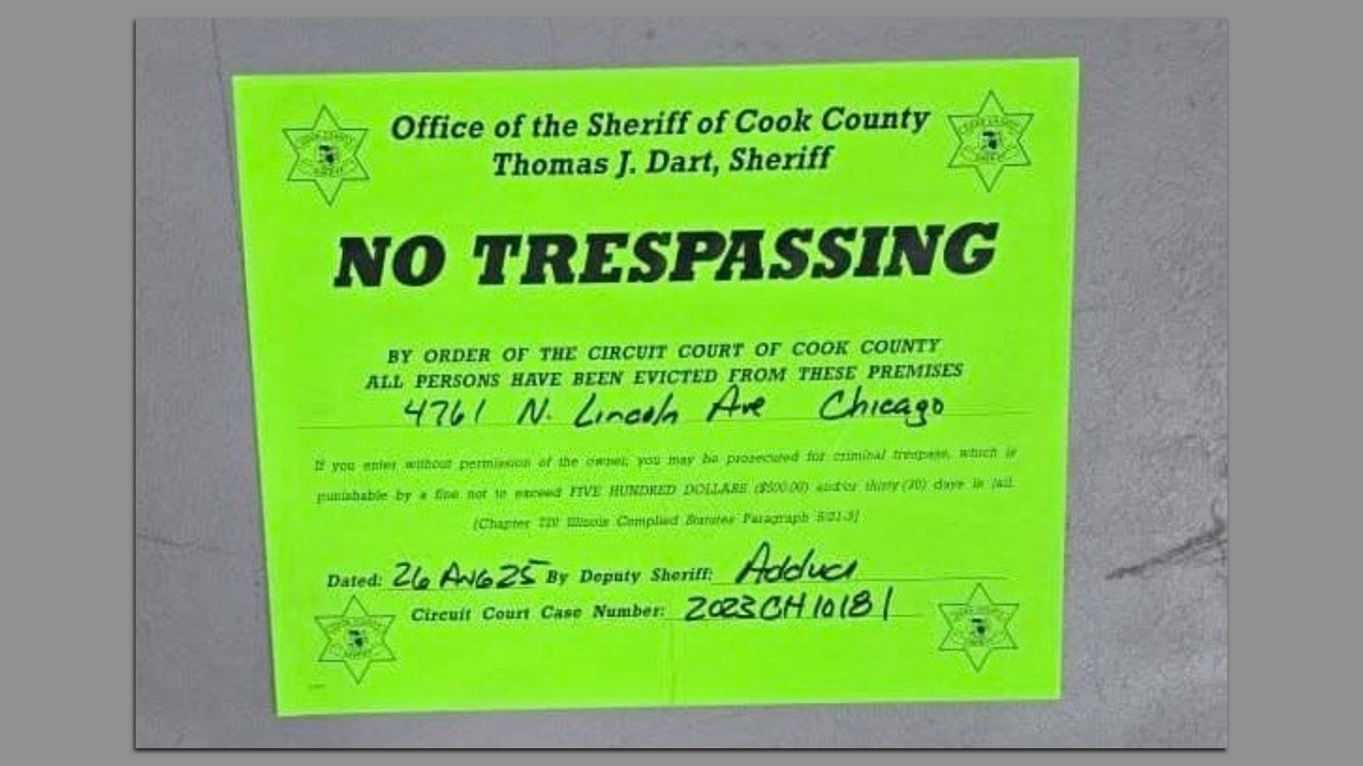 Bright green "No Trespassing" sign from Cook County Sheriff warning eviction at 4761 N. Lincoln Ave, Chicago, with legal and penalty details and dated 26 Aug 25.