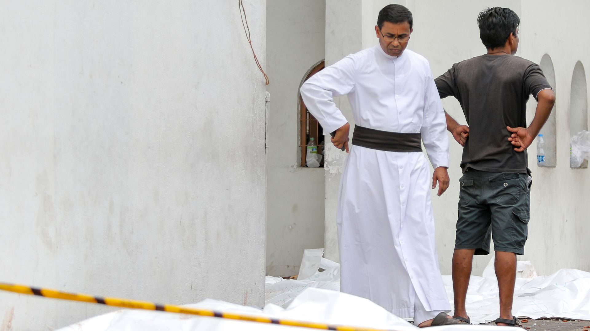 A Sri Lankan Catholic priest among the dead outside a church targeted in the attacks.