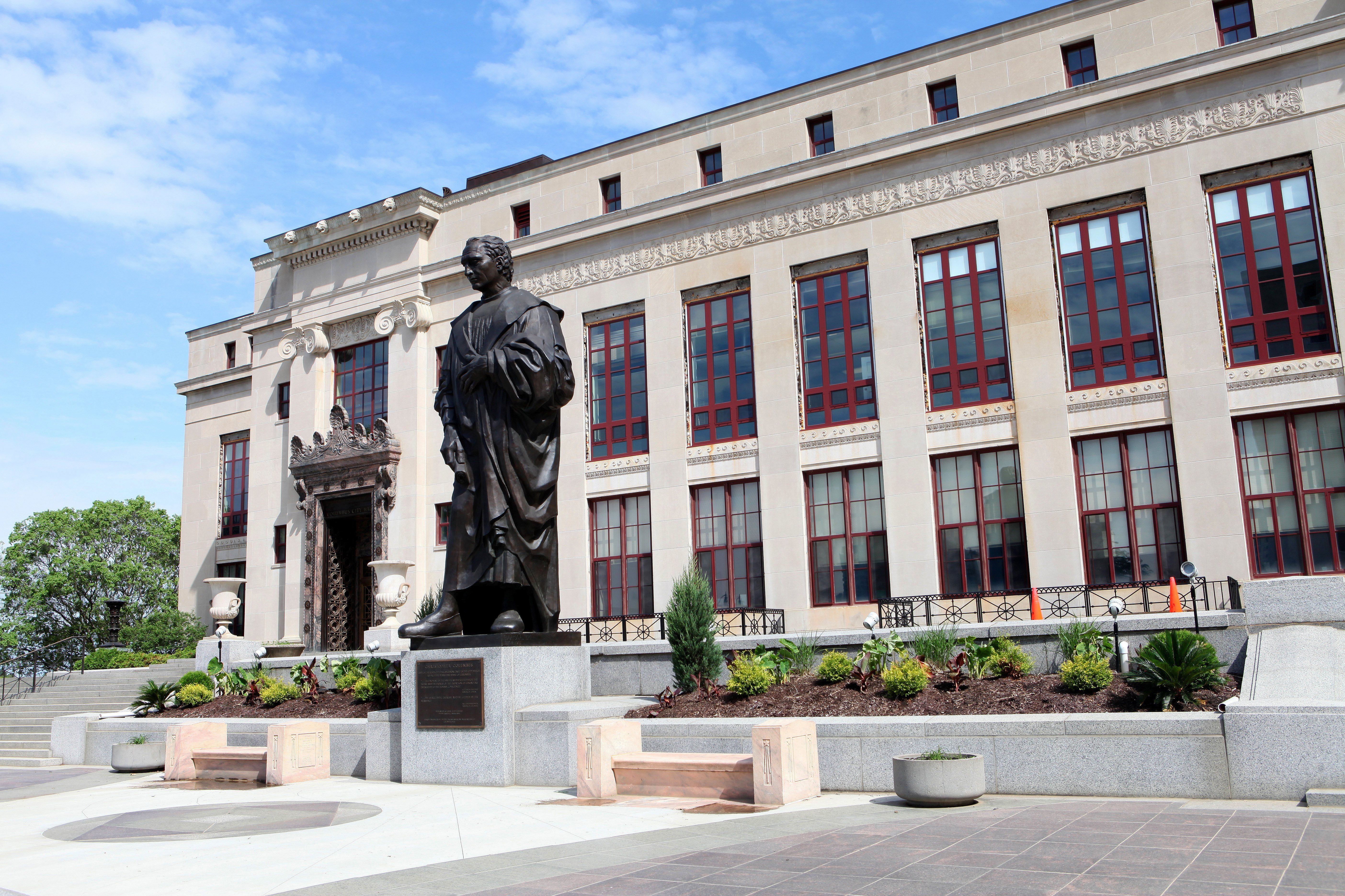 An exterior view of Columbus City Hall, when a 22-foot Christopher Columbus statue was still outside it.