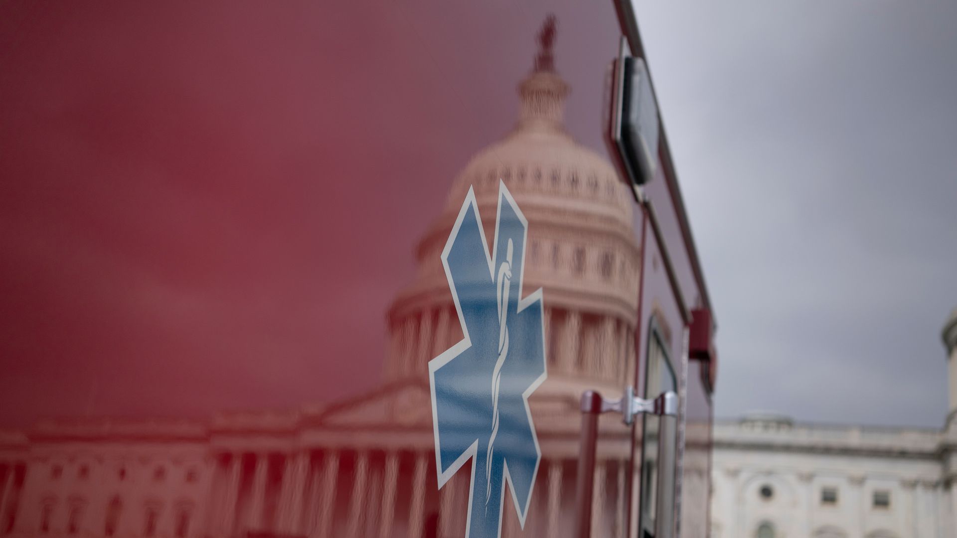 Capitol reflected in side of an ambulance