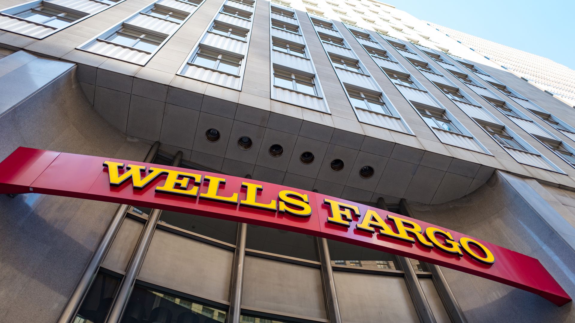 Signage with logo at headquarters of Wells Fargo Capital Finance, the commercial banking division of Wells Fargo Bank, in the Financial District neighborhood of San Francisco, California.