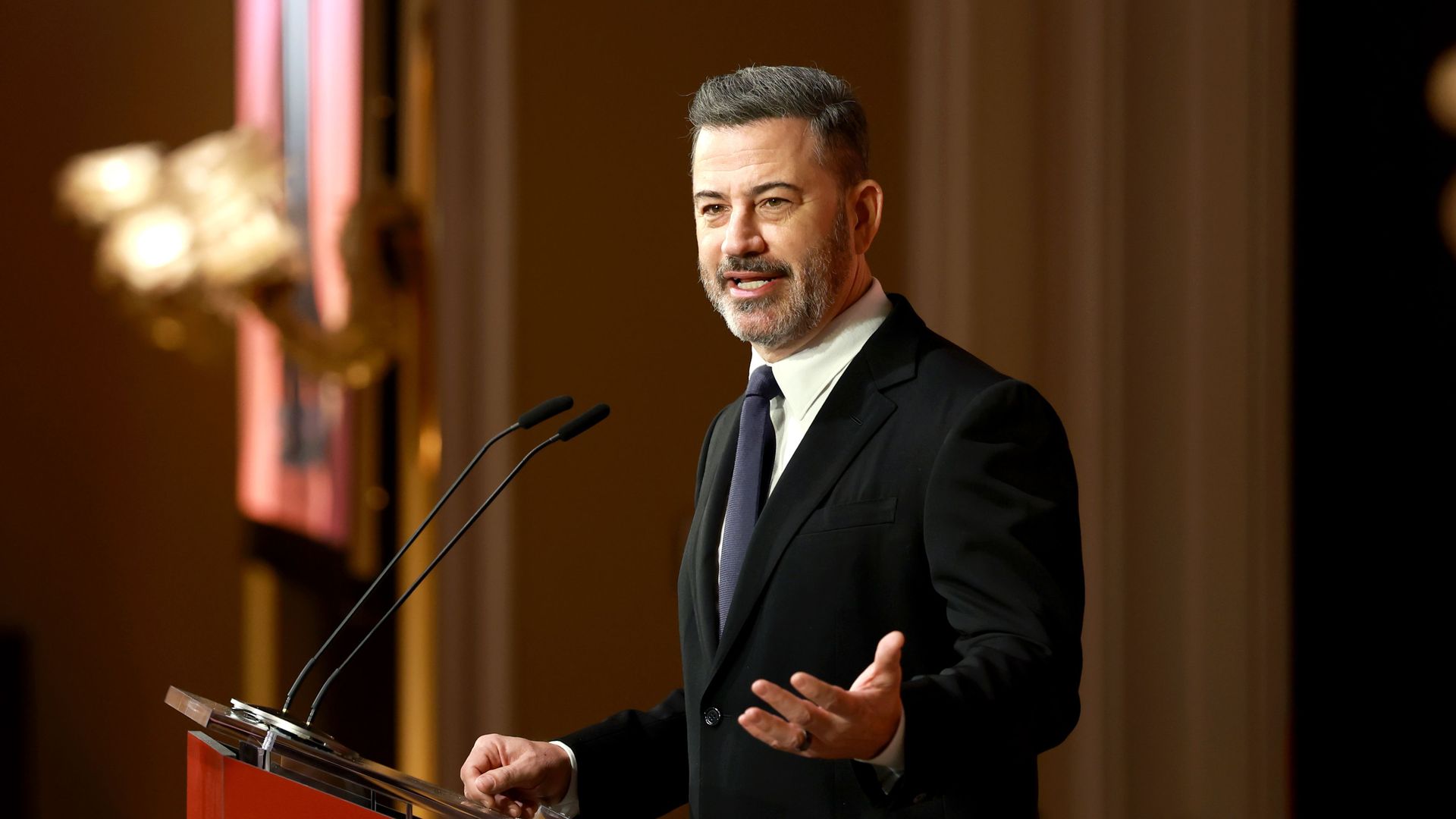Jimmy Kimmel speaks at a podium