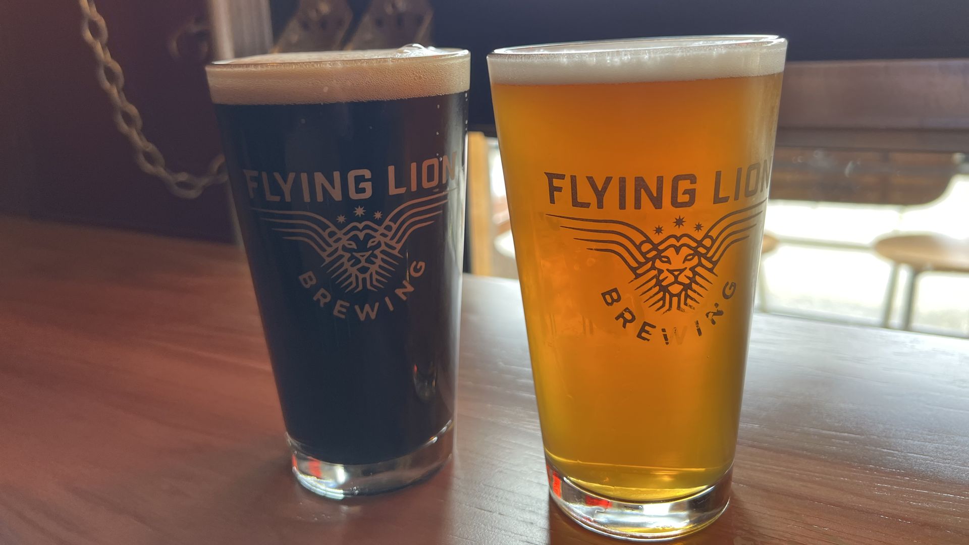 Two full pints of the Sunday Golden Lager and Hitt's Hill Pilsner at Flying Lion Brewing in Columbia City.
