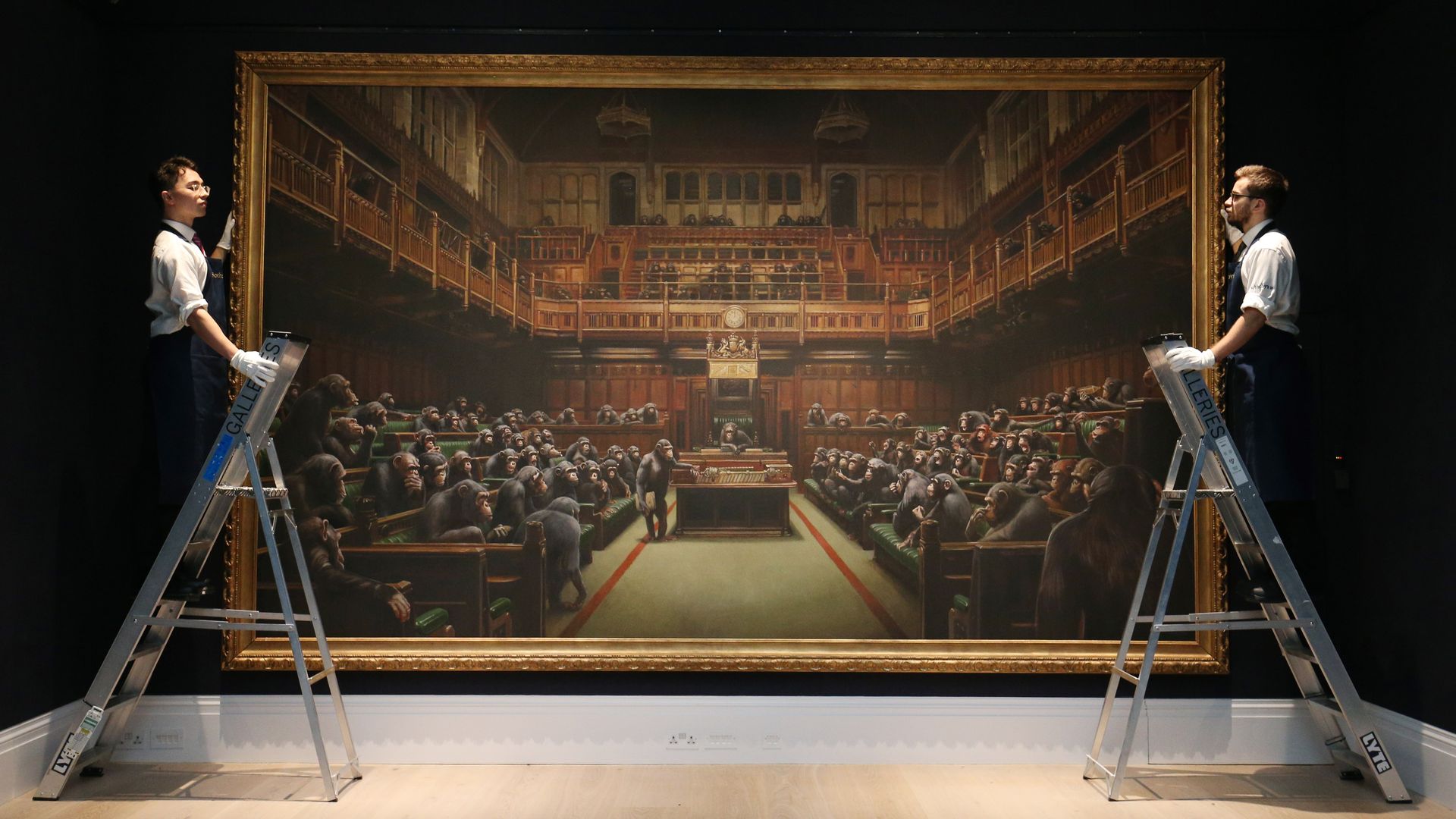 Banksy's painting "Devolved Parliament" depicts chimpanzees as members of the British House of Commons. 