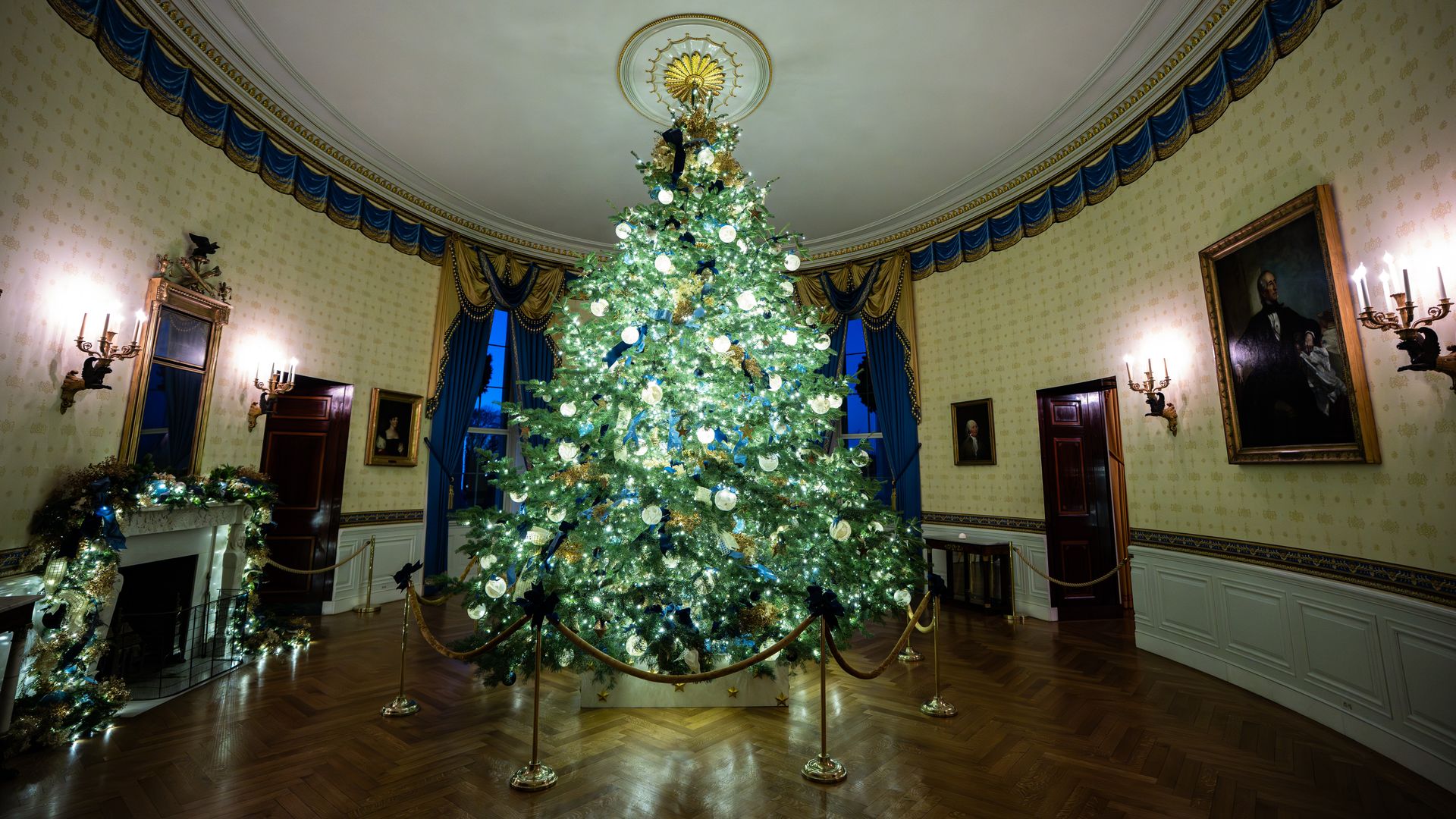 The White House Christmas tree from Michigan is seen in the Blue Room. 