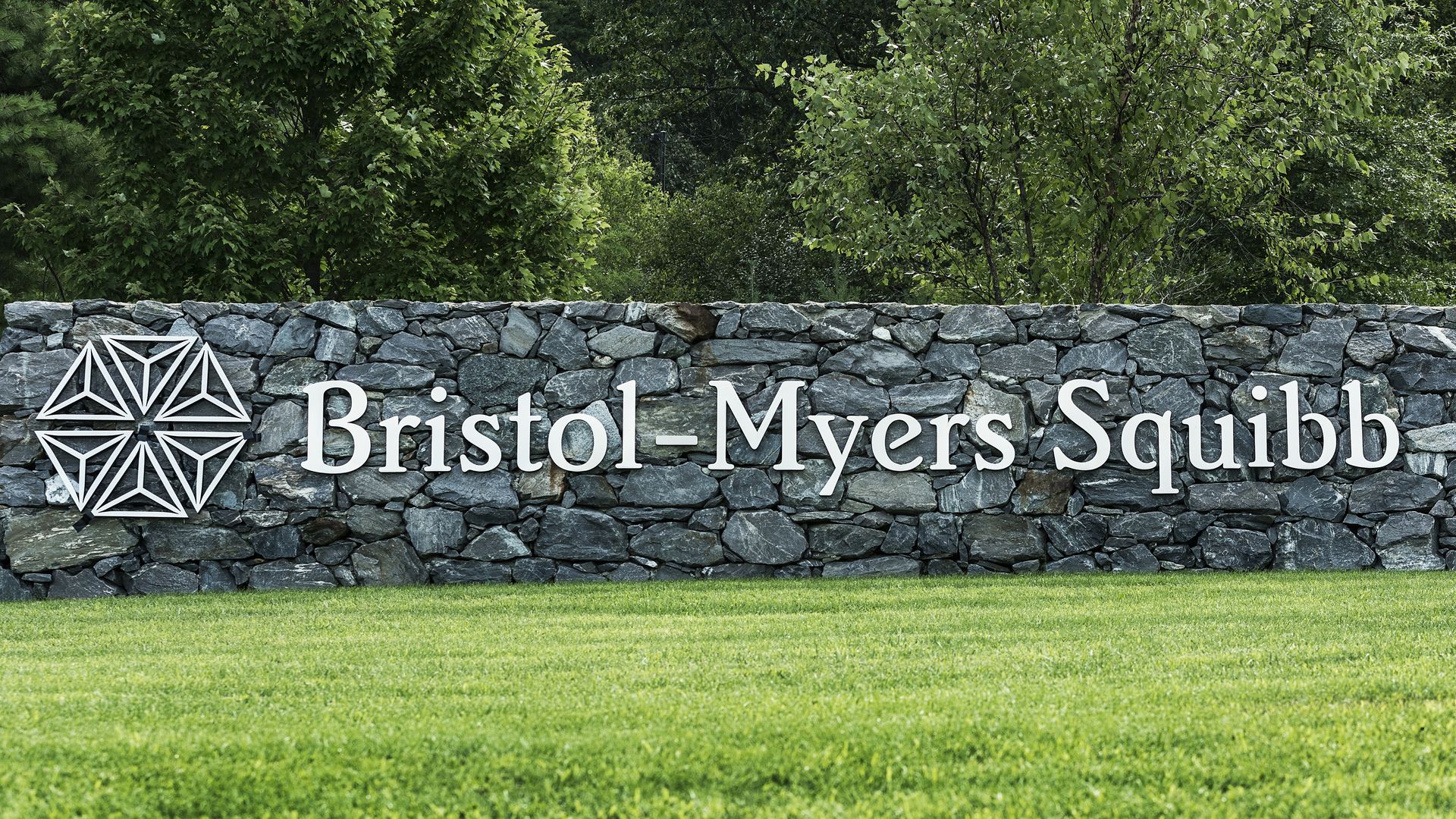 A sign with the Bristol-Myers Squibb logo