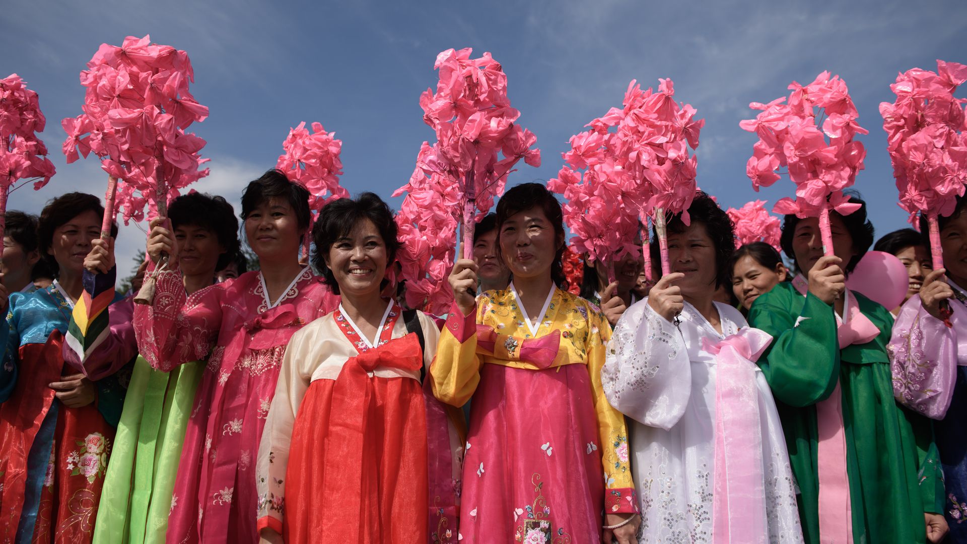 Korean women wearing colorful dresses.