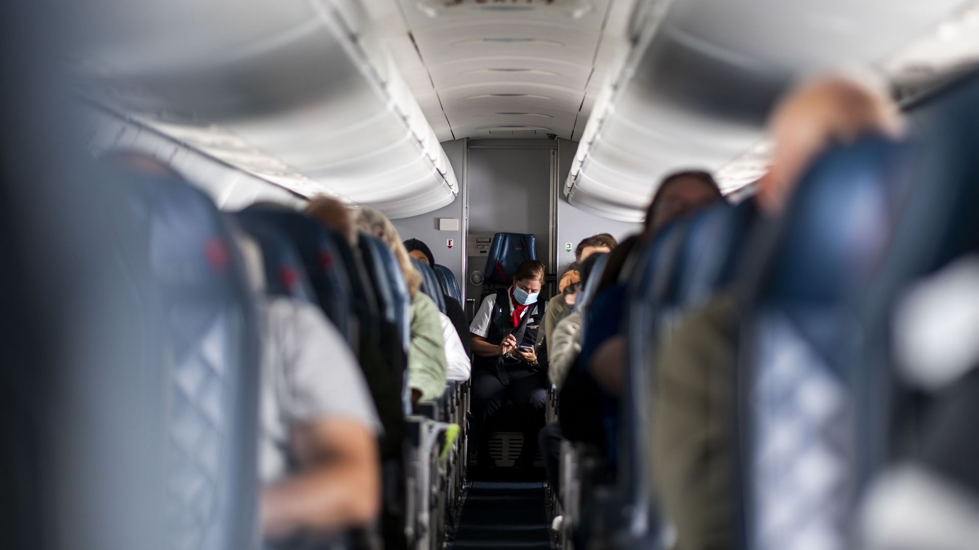 QUEENS, NY - MAY 04: Passengers and flight attendants aboard a flight from LaGuardia Airport bound for Kansas City International Airport on Wednesday, May 4, 2022 in Queens, NY.