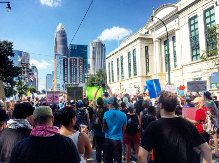 Chants of "No tapes, no peace" on the steps of CMPD headquarters