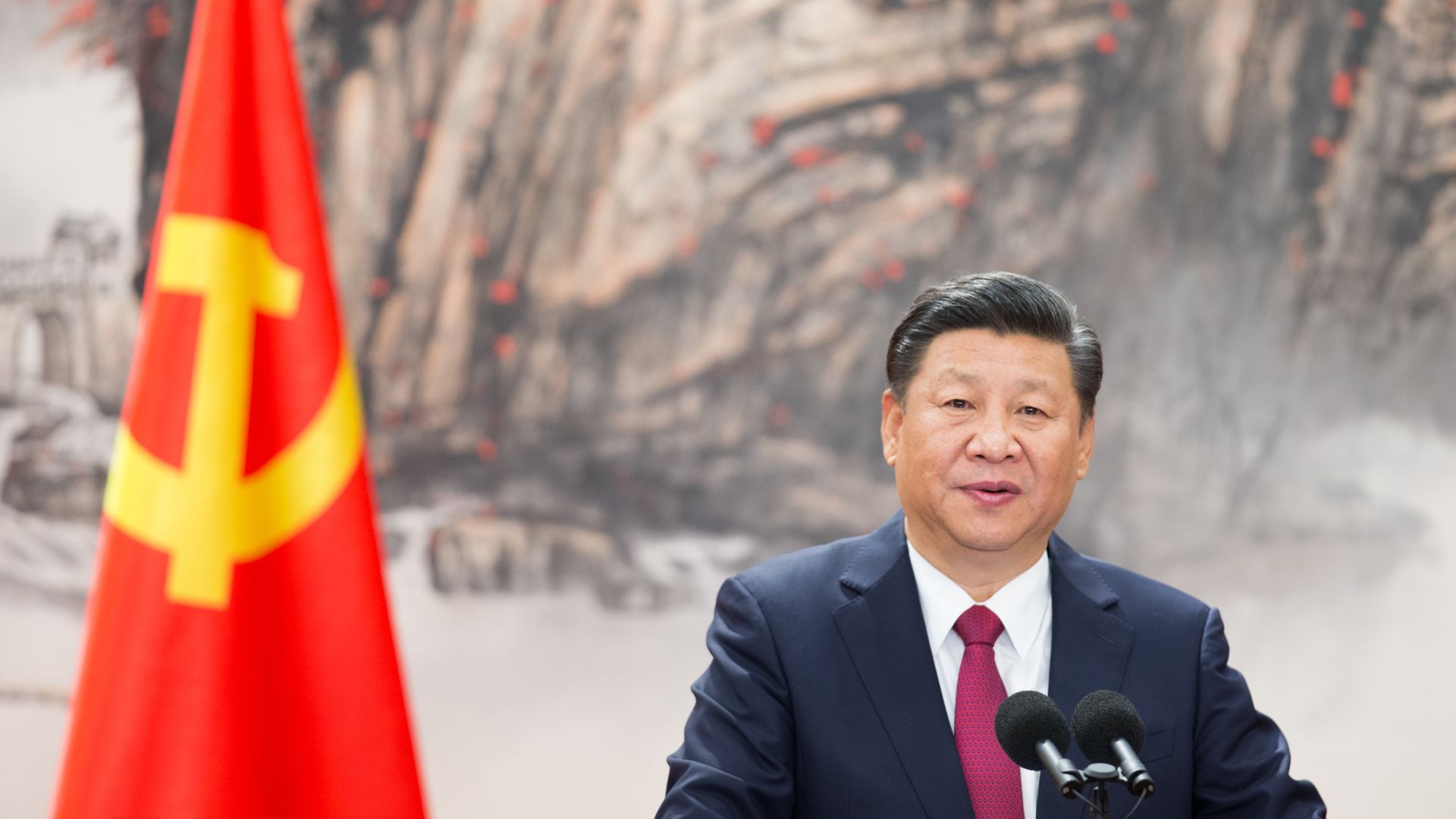 Chinese President Xi Jinping stand at podium in front of his party members in October 2017