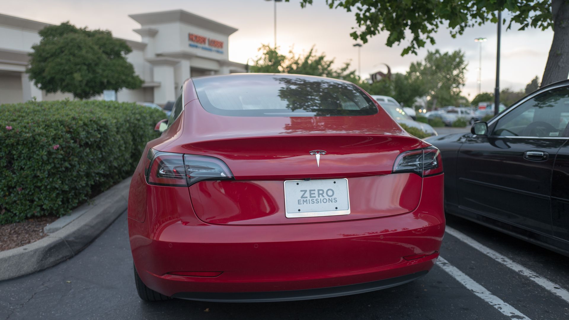 The backend of a Tesla model 3 sedan.
