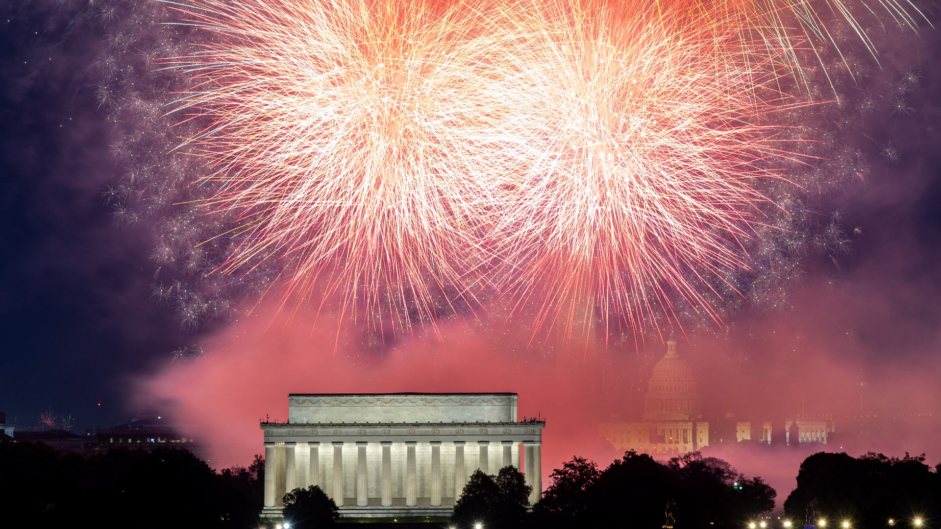 Fireworks illuminate the skyline above the Lincoln Memorial, Washington Monument, and U.S. Capitol during U.S. Independence Day celebrations, as seen from Arlington, VA, on July 4, 2025. (Photo by Mehmet Eser / Middle East Images via AFP) (Photo by MEHMET ESER/Middle East Images/AFP via Getty Images