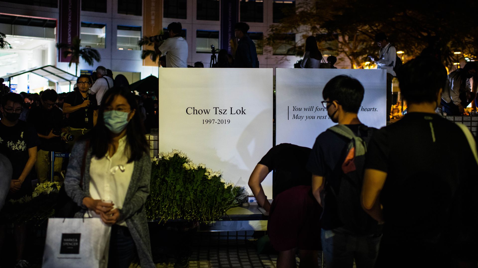 Hong Kong students and protesters gather to pay tribute to Chow Tsz-lok.