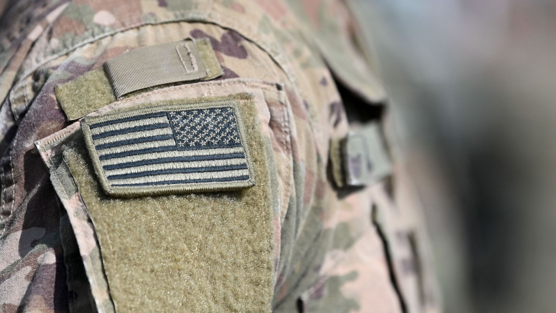 A U.S. solider wears an American Flag patch on his uniform.