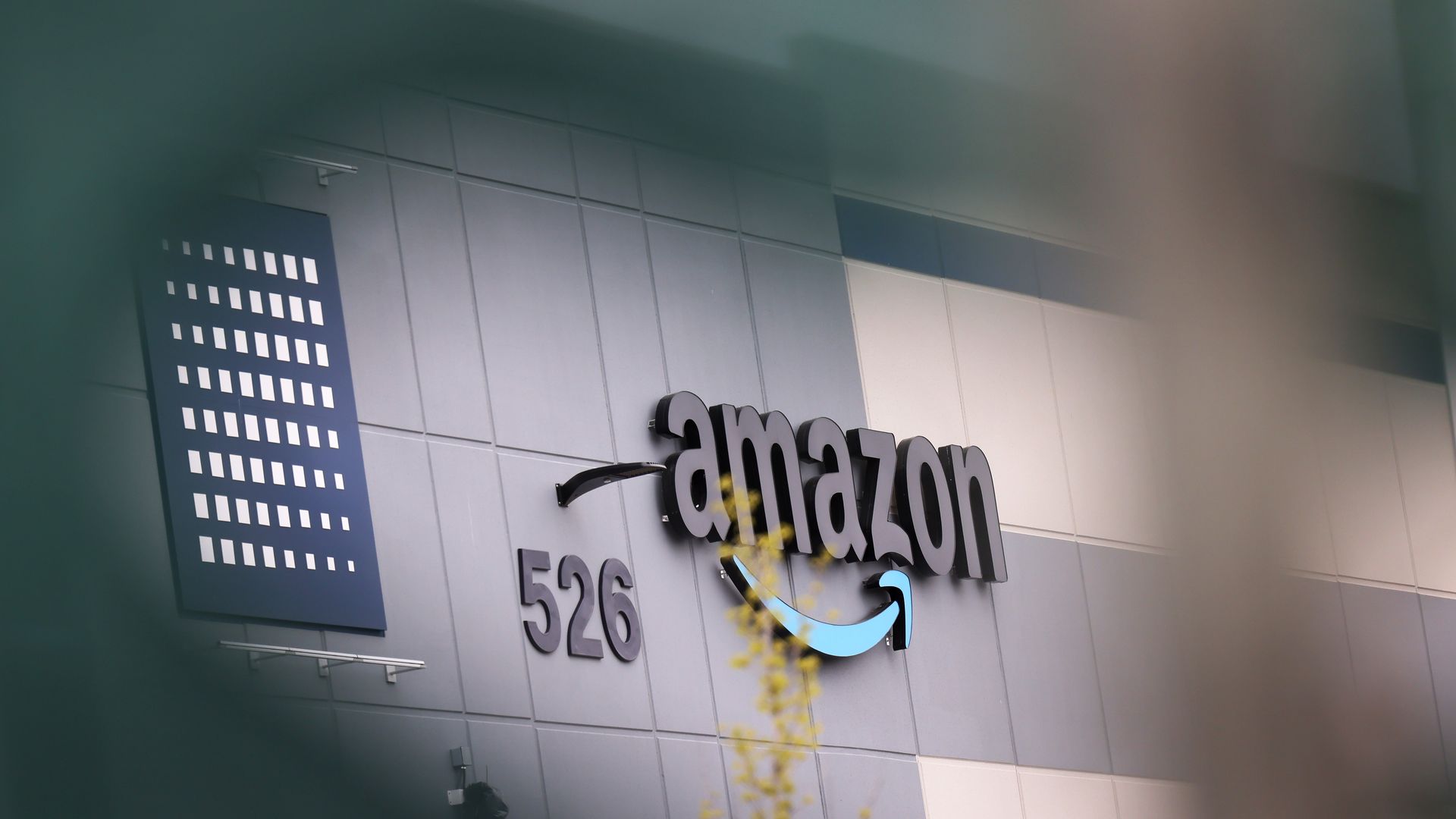 An Amazon logo on the outside of a warehouse in New York City in April 2022.