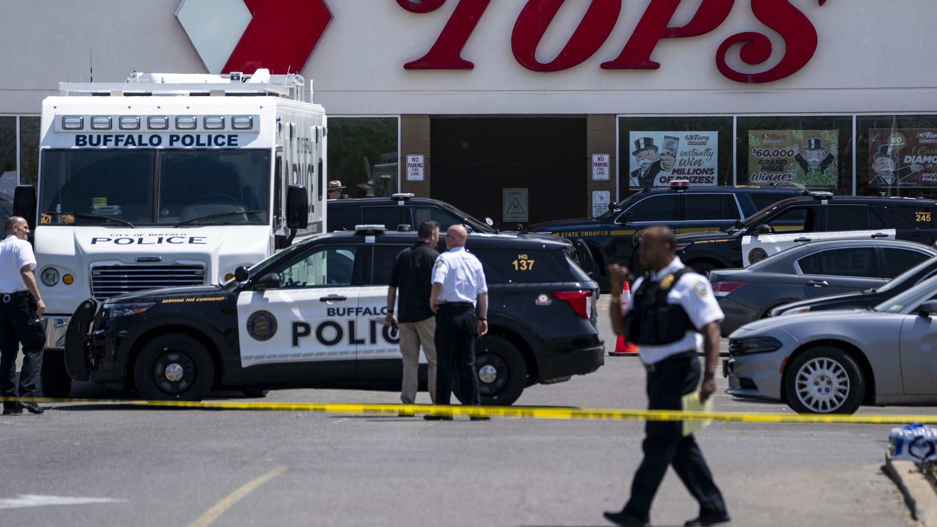 Law enforcement officials at the scene of a mass shooting at Tops grocery store in Buffalo, New York, on May 15, 2022.