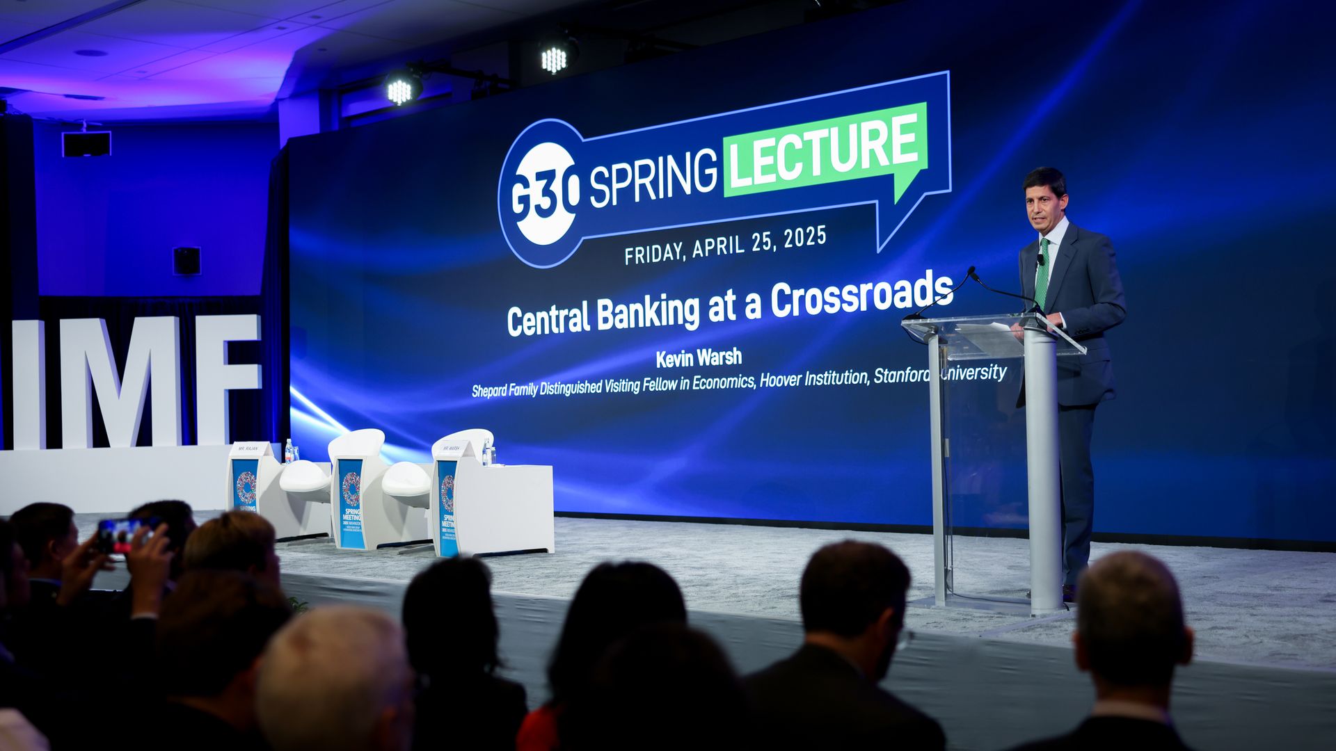 Photo of Kevin Warsh on stage delivering a lecture