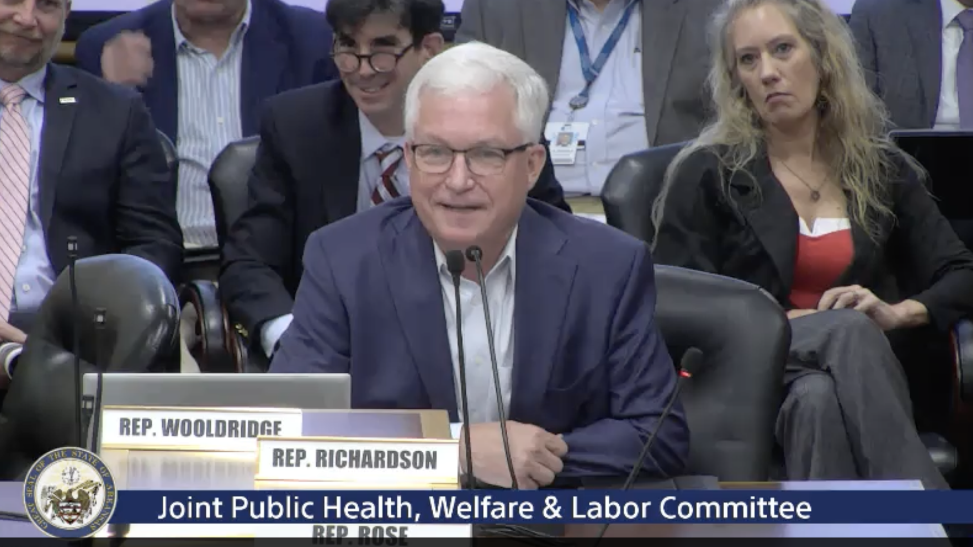 A screenshot of President and CEO of the Arkansas Center for Health Improvement, Joseph Thompson, presenting in a joint committee.