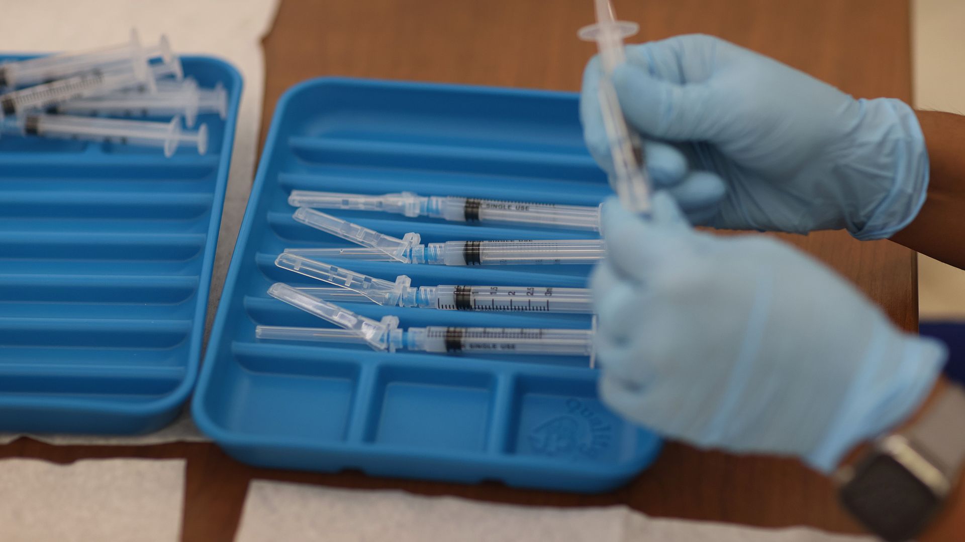 Picture of syringes in a blue plastic container