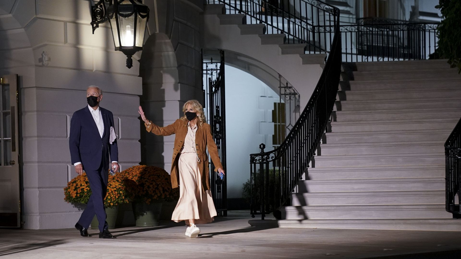 President Joe Biden and First Lady Jill Biden walk on the South Lawn of the White House before boarding Marine One in Washington, D.C., U.S., on Friday, Oct. 22, 2021. 
