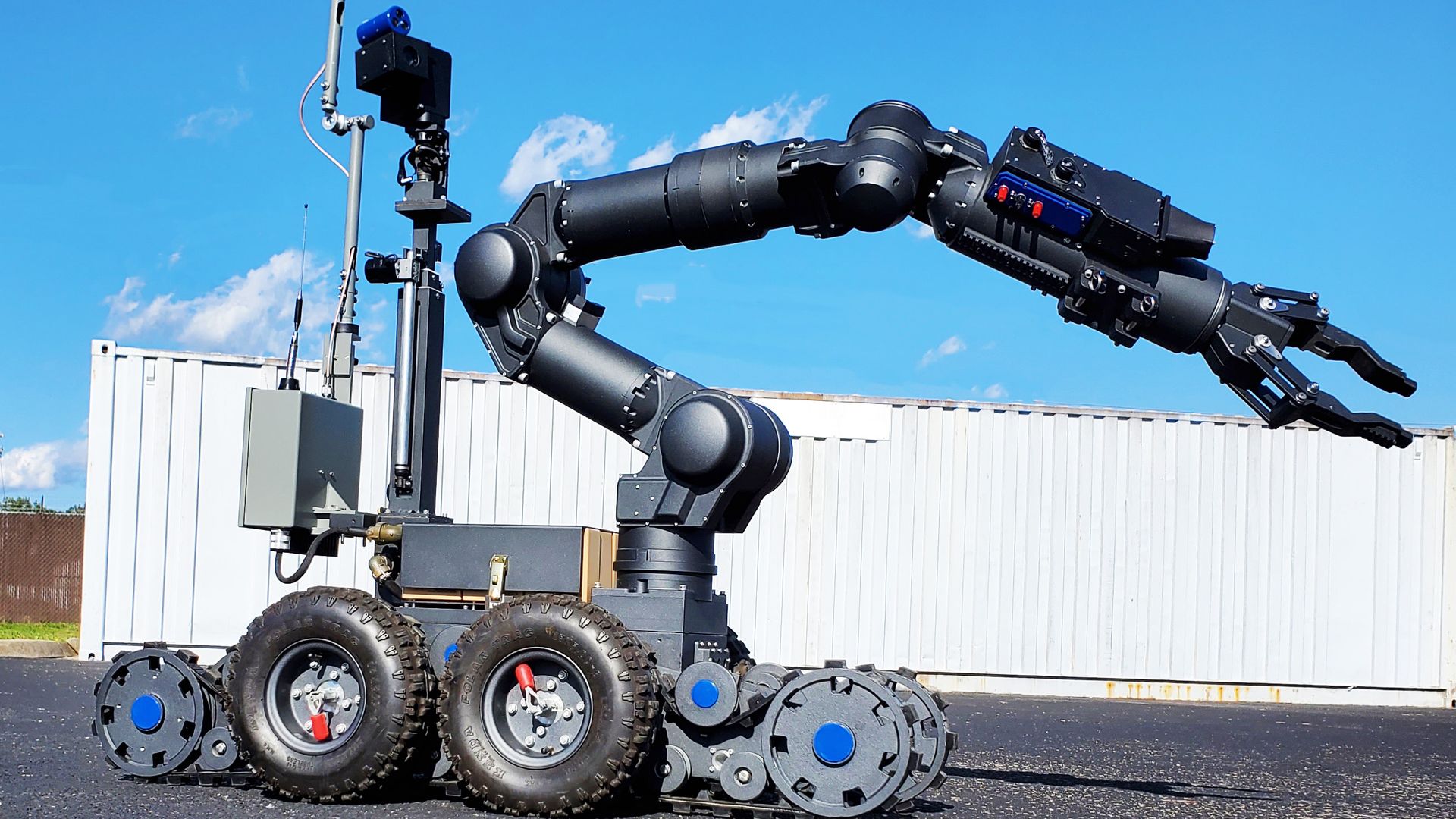 Bomb robot with an articulating arm