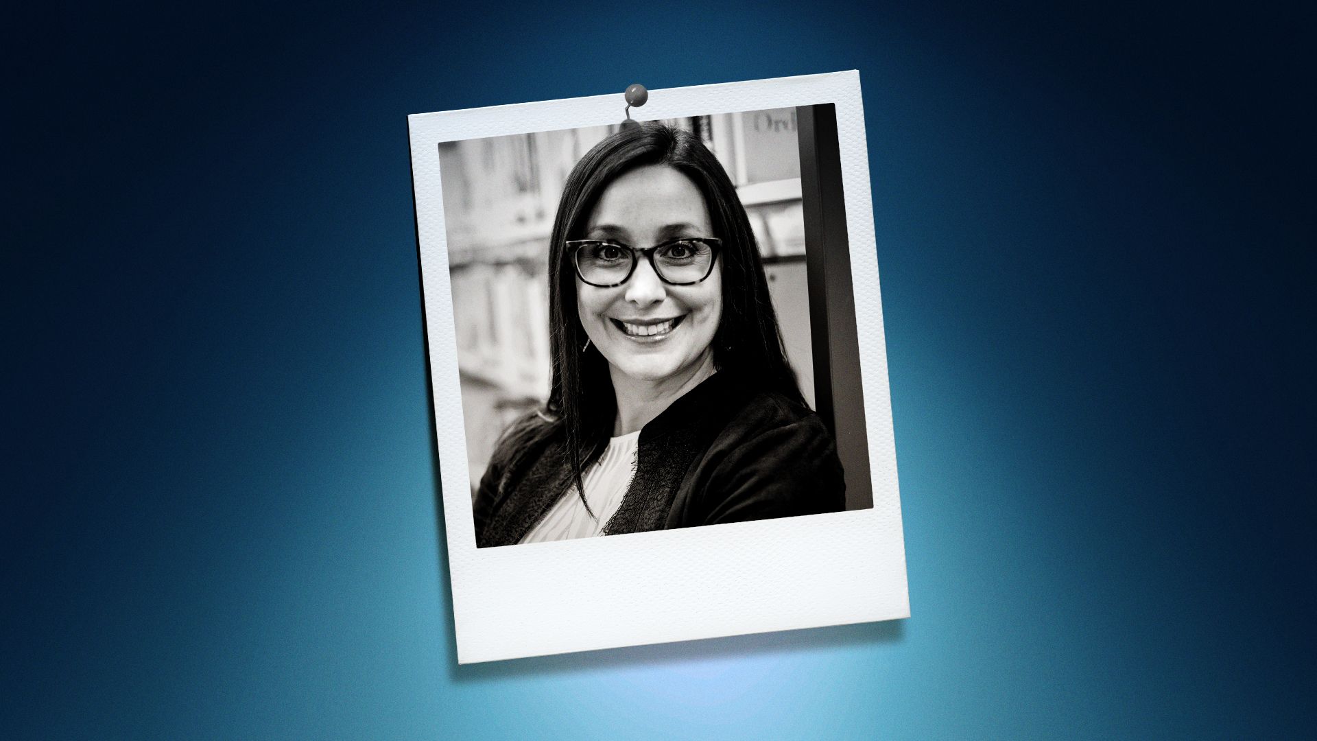 Photo illustration of Nicholle Davies in a polaroid on a blue background. 