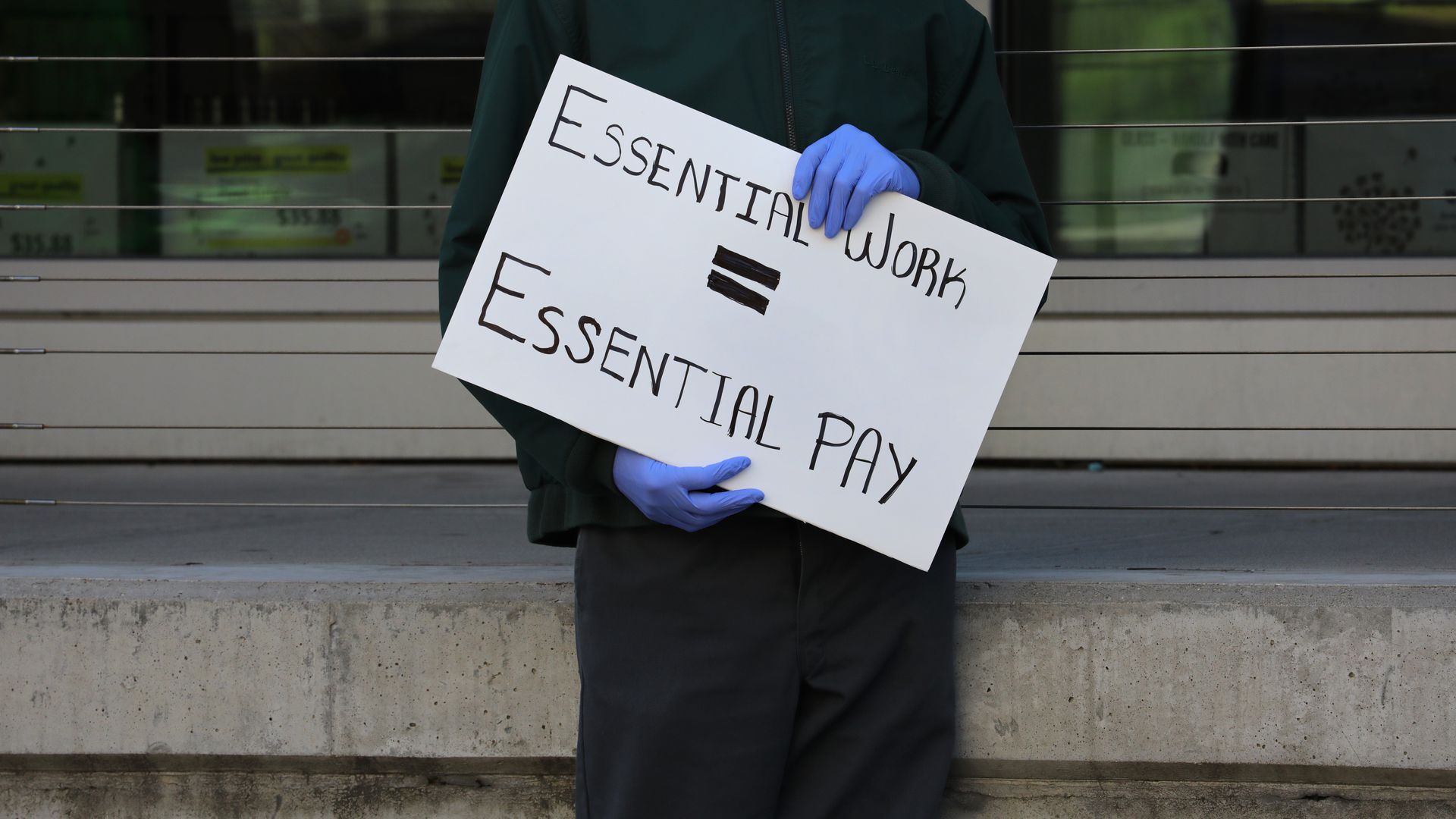 Worker holding a sign