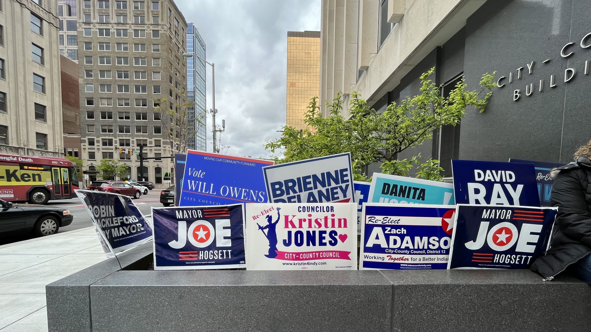 Yard signs stuffed in landscaping outside the City-County Building in downtown Indianapolis.