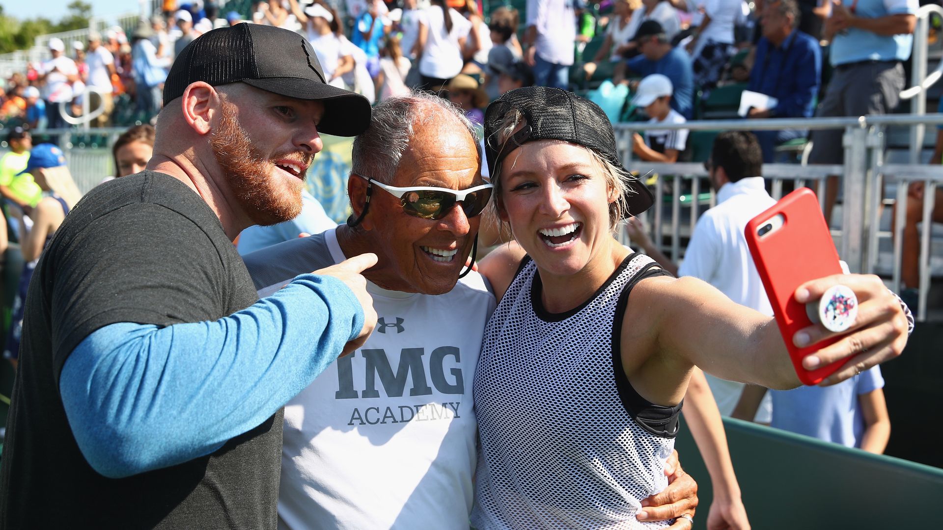 Bethanie Matek Sands of the United States takes a selfie with tennis coach Nick Bollettieri after taking part at the Kids Day event 