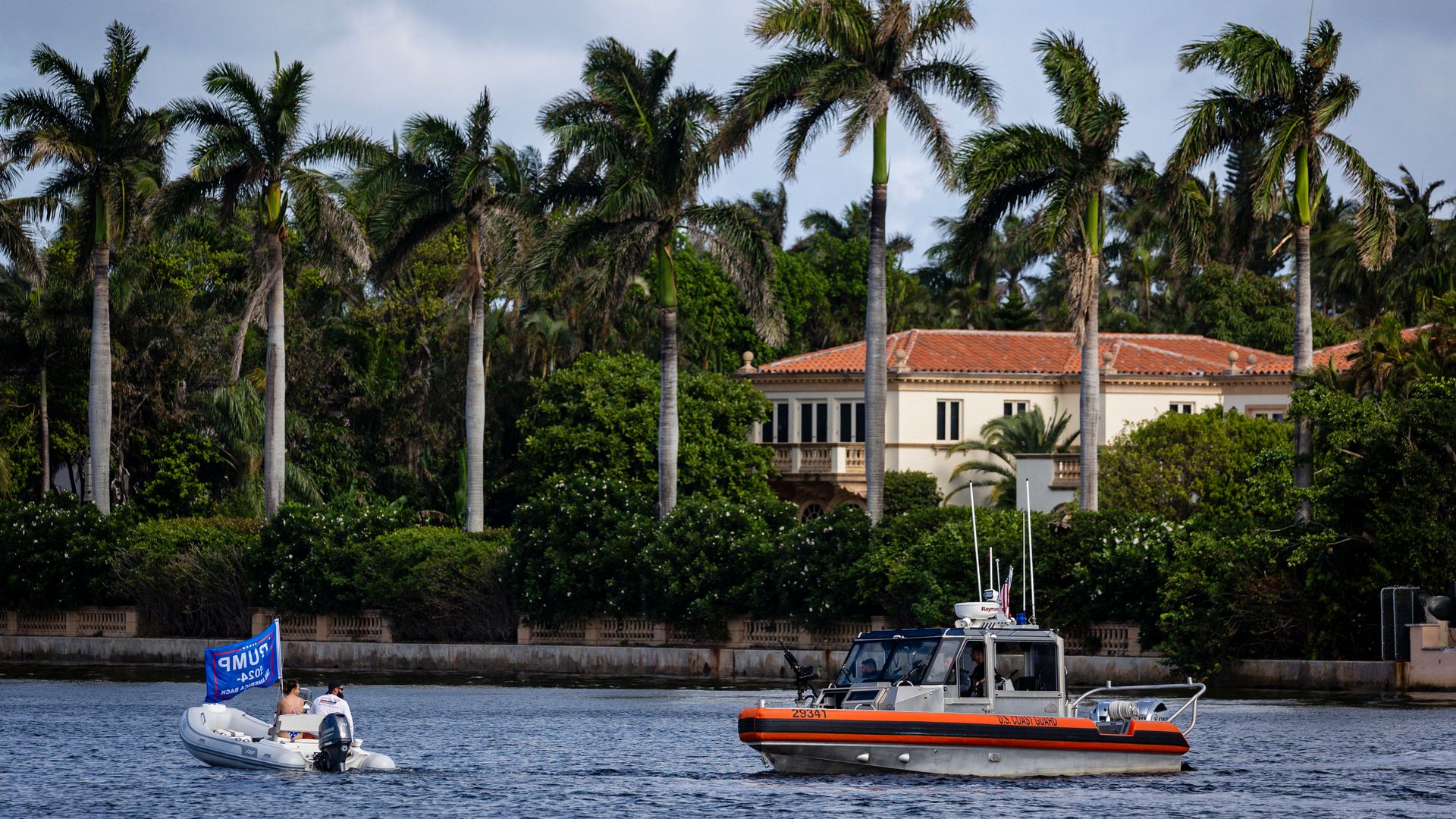 : A boat holding a campaign flag is seen near Mar-a-Lago, the residence of US president-elect Donald Trump on November 8, 2024 in Palm Beach, Florida. President-elect Donald J. Trump and Republicans are awaiting the results of key House races that will determine control of Congress. Ongoing ballot c