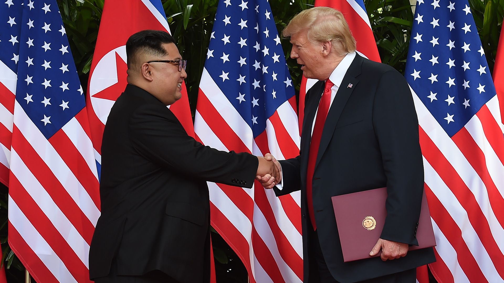 Trump and Kim shake hands at the end of the summit