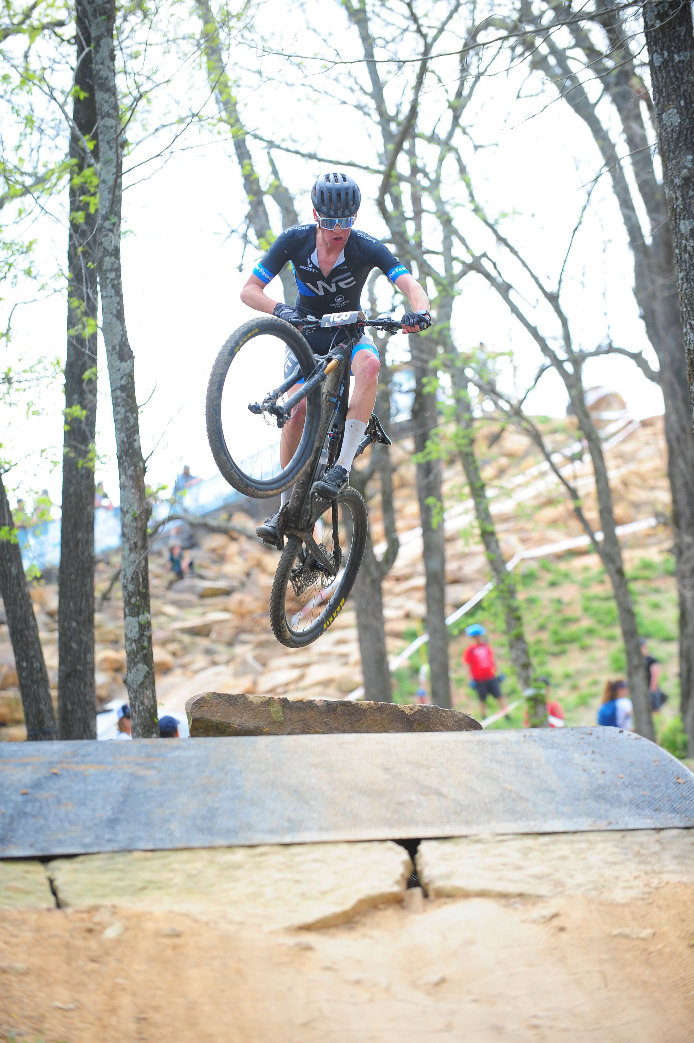 A guy on a mountain bike catches some air. 