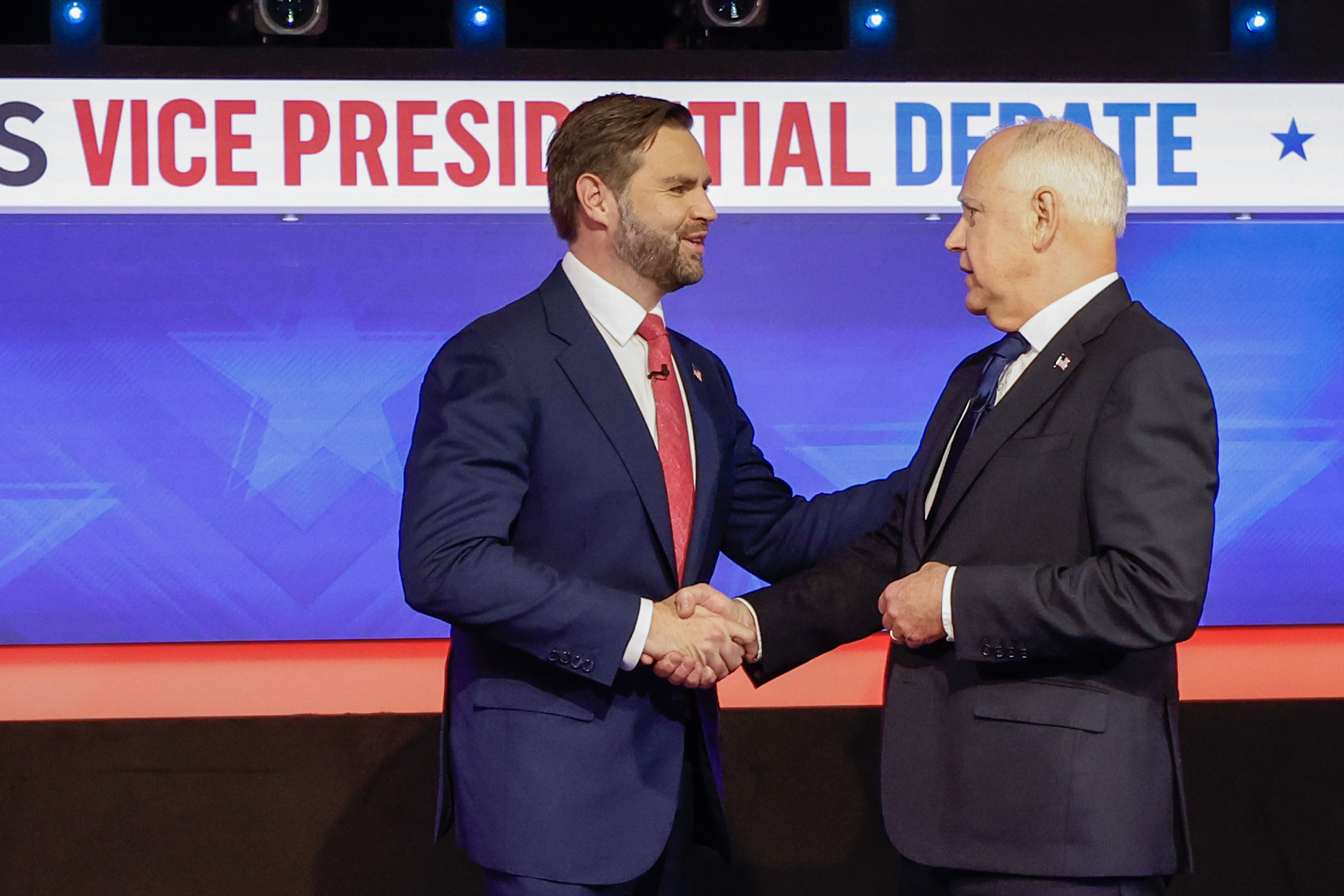 Sen. JD Vance and Gov. Tim Walz shake hands before their vice presidential debate at the CBS Broadcast Center in Manhattan.