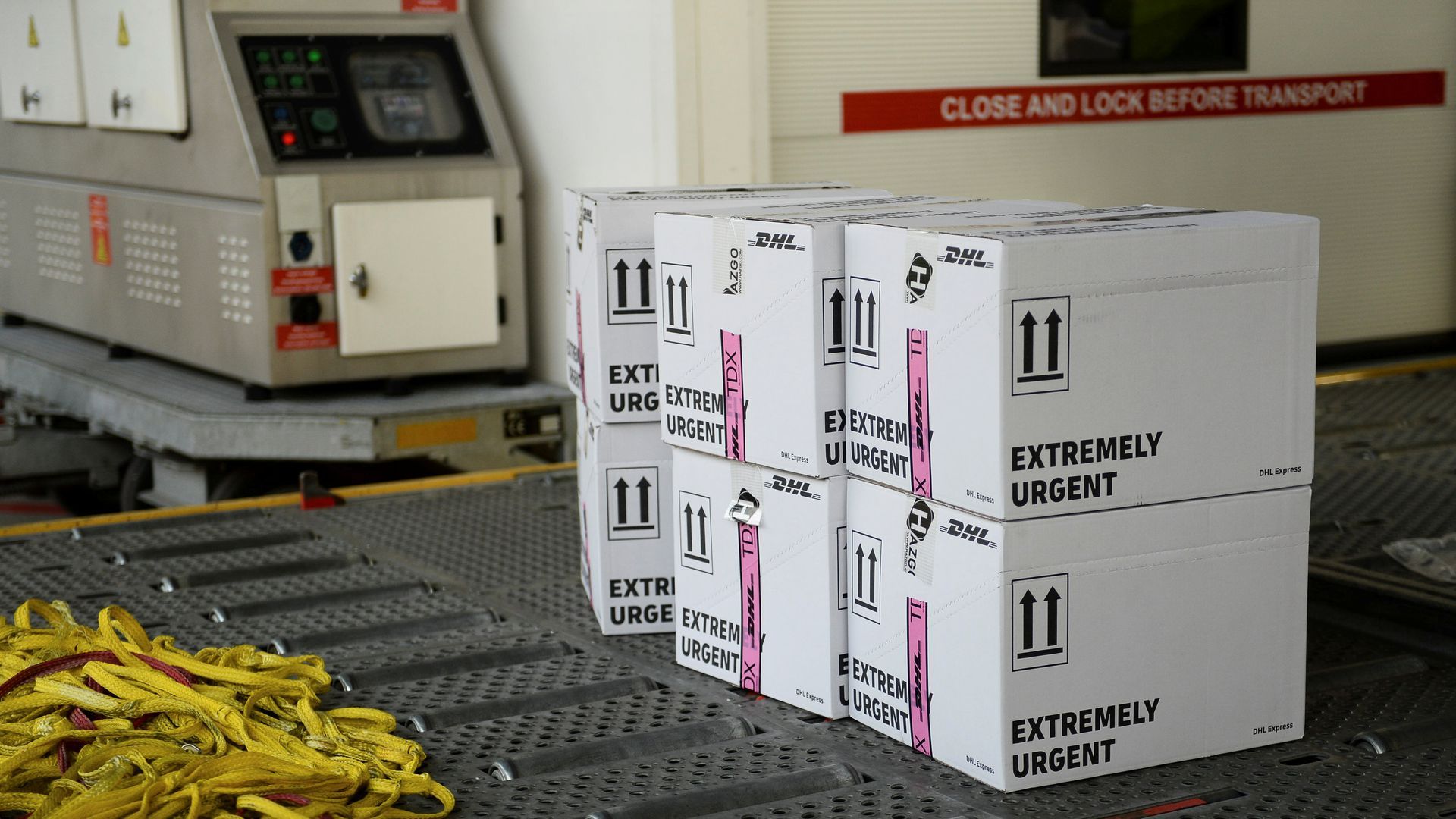 A stack of boxes that say "extremely urgent" on the side.