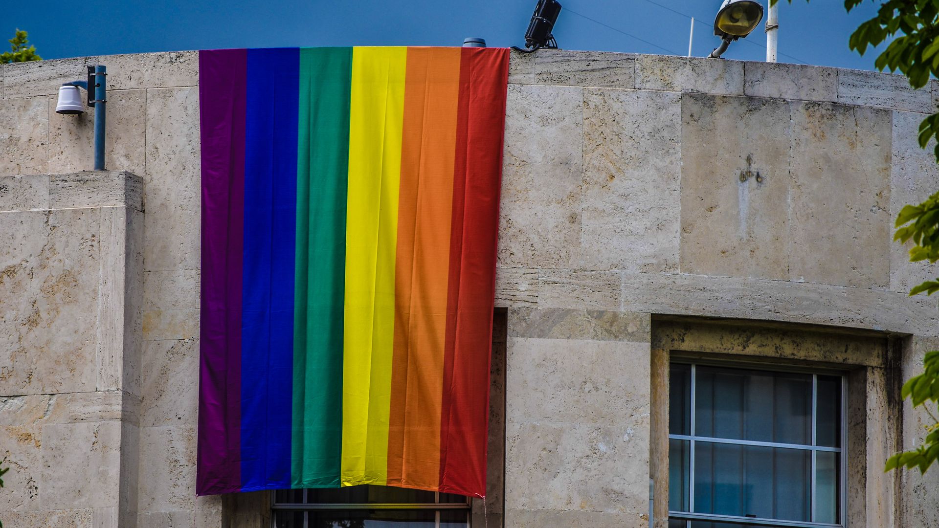 An LGBTQ+ pride flag hangs over the U.S. Embassy in Turkey 