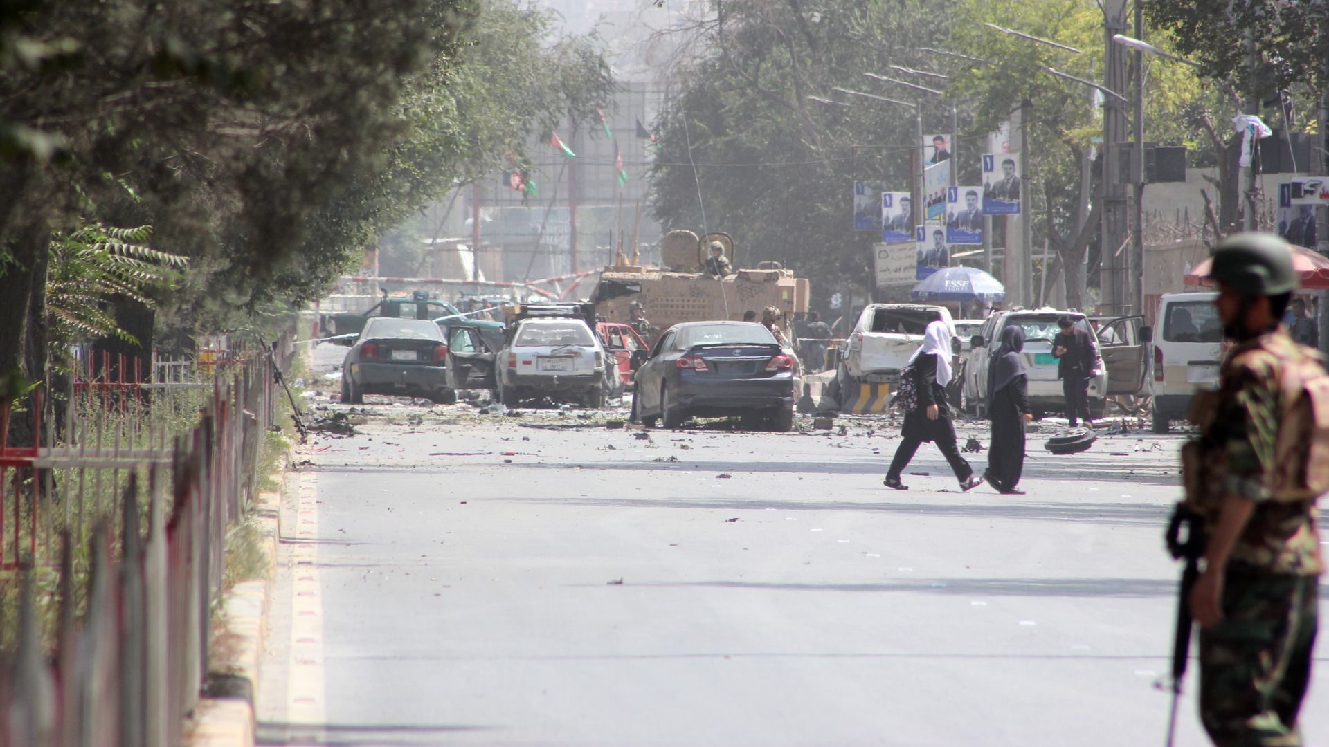 Security forces stand guard after a massive suicide car bombing rocked Afghan capital Kabul's diplomatic enclave