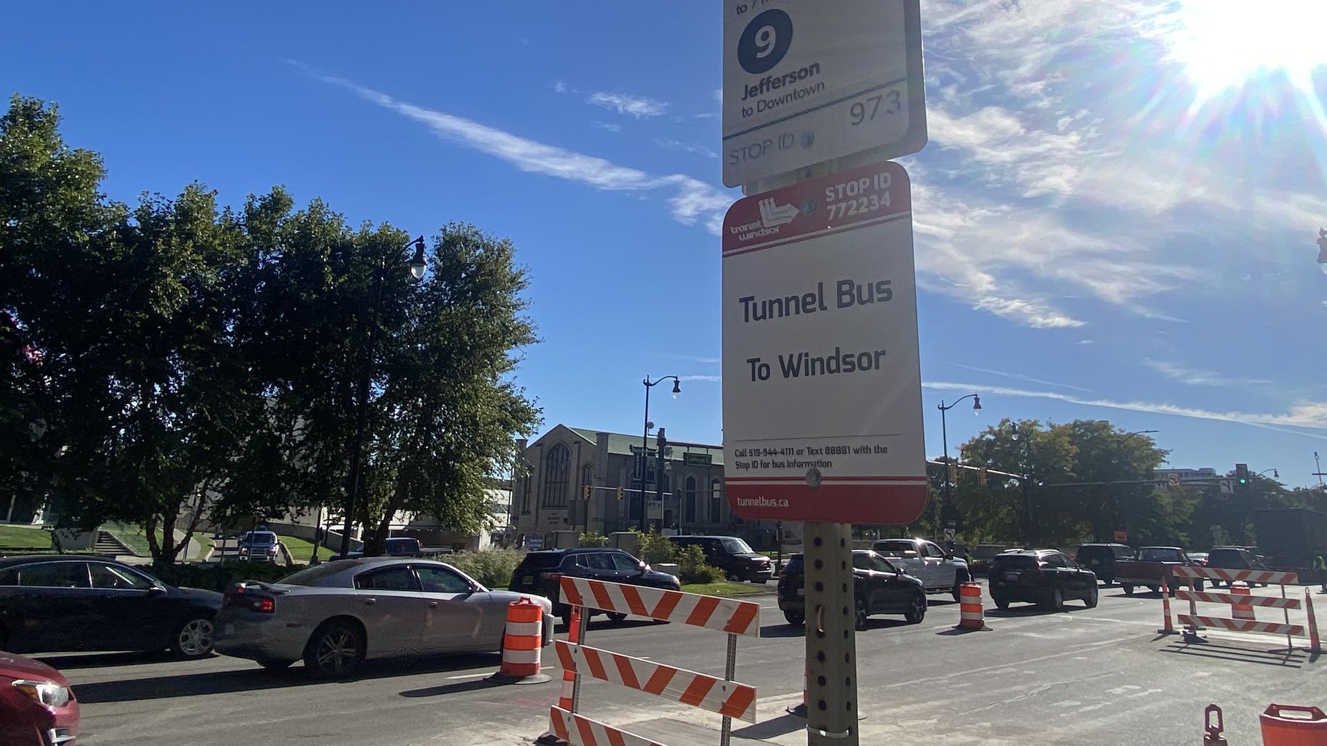 A sign at a bus stop is shown.