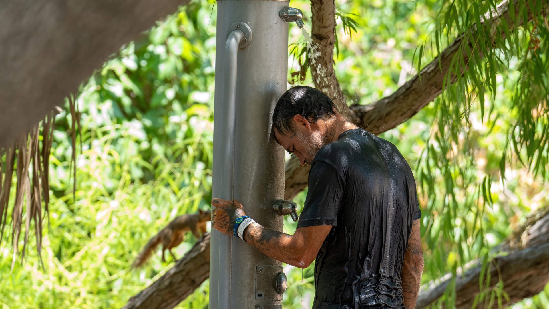 A man cools off by Lady Bird Lake as extreme temperatures across Texas have prompted the National Weather Service to issue excessive heat warnings and heat advisories that affect more than 40 million people in Austin, Texas, on June 27, 2023. 