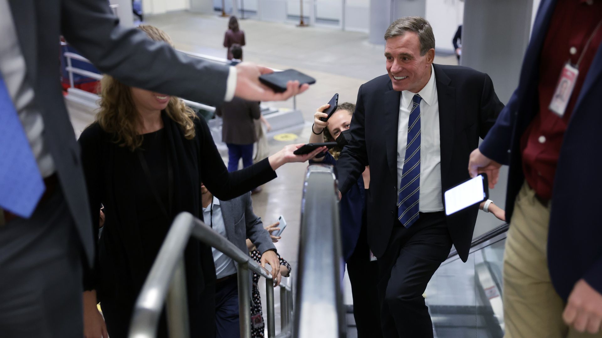 Warner on an escalator