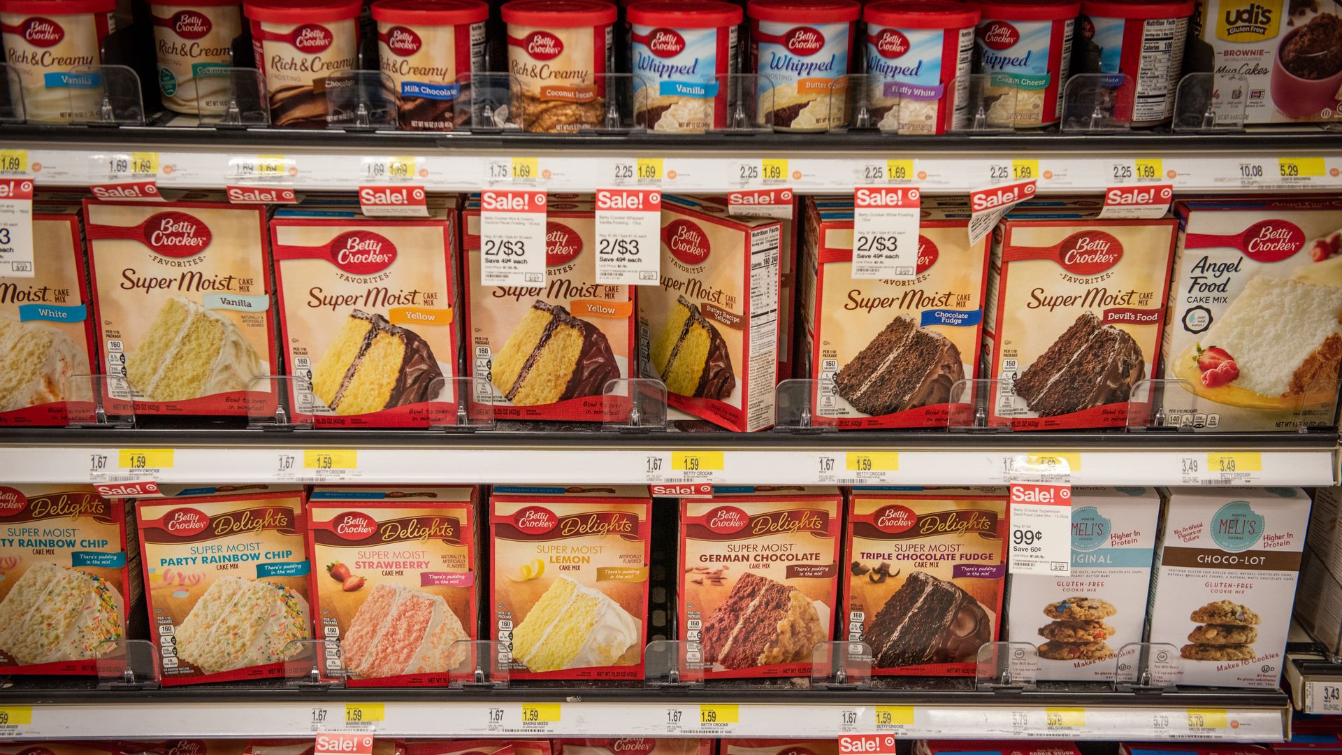 Betty Crocker cake mixes and frosting on a grocery store shelf 