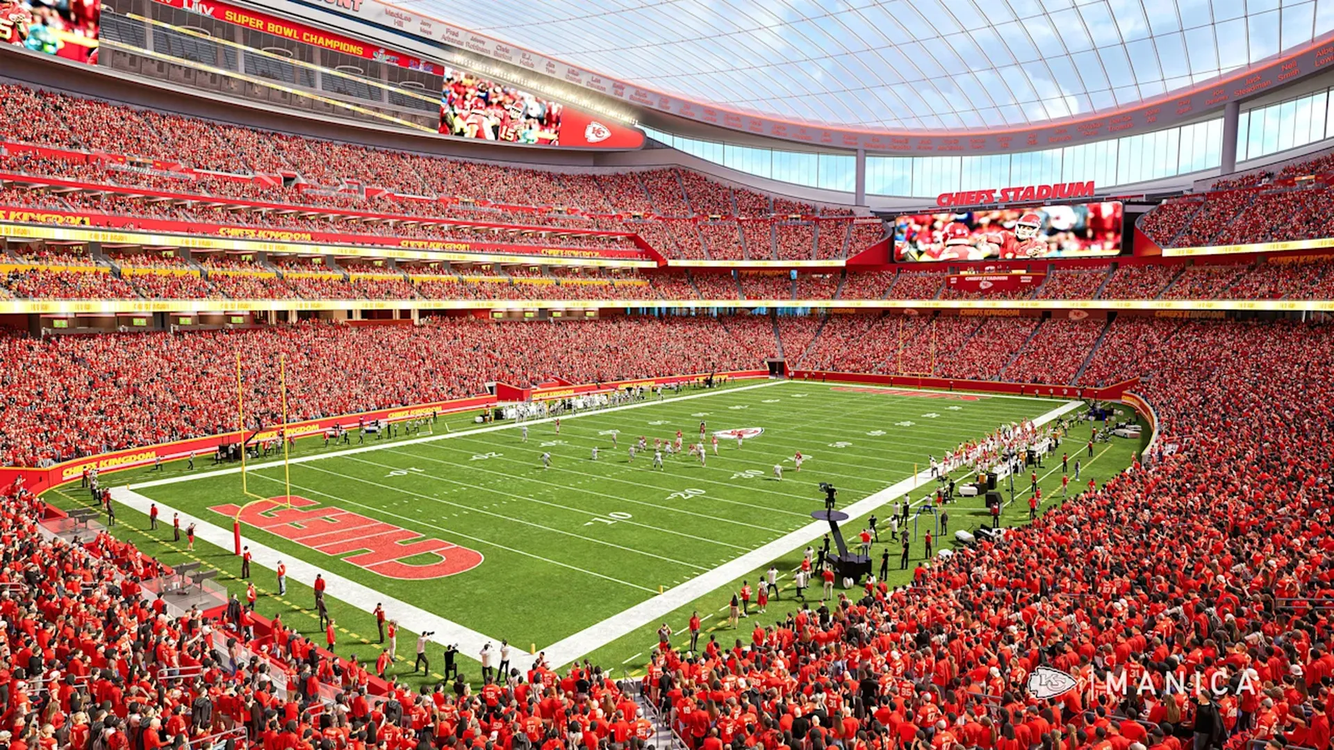 Packed stadium with red-clad fans; green football field with yard lines and a large red end zone marked KC, with several video boards displaying the game.
