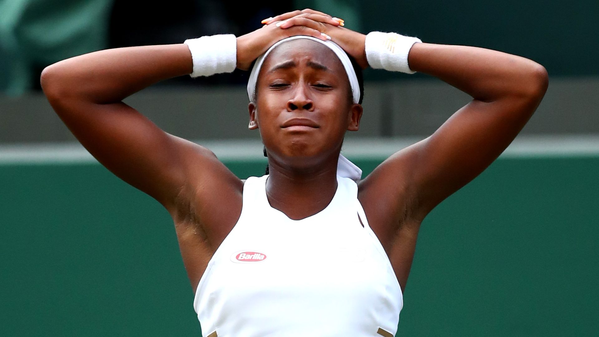 Coco Gauff with her hands on her hand