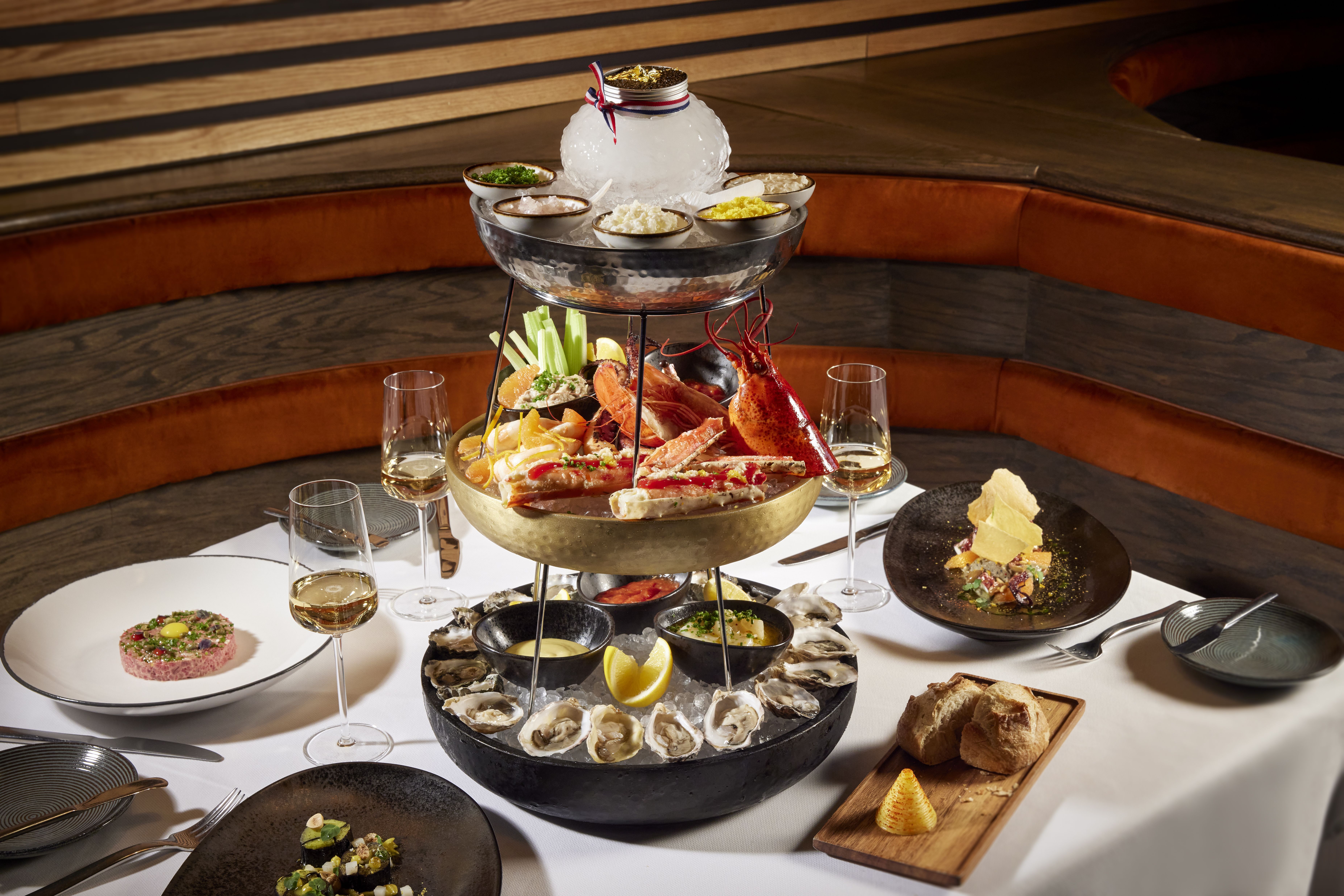 A seafood twoer with clams oysters and lobster