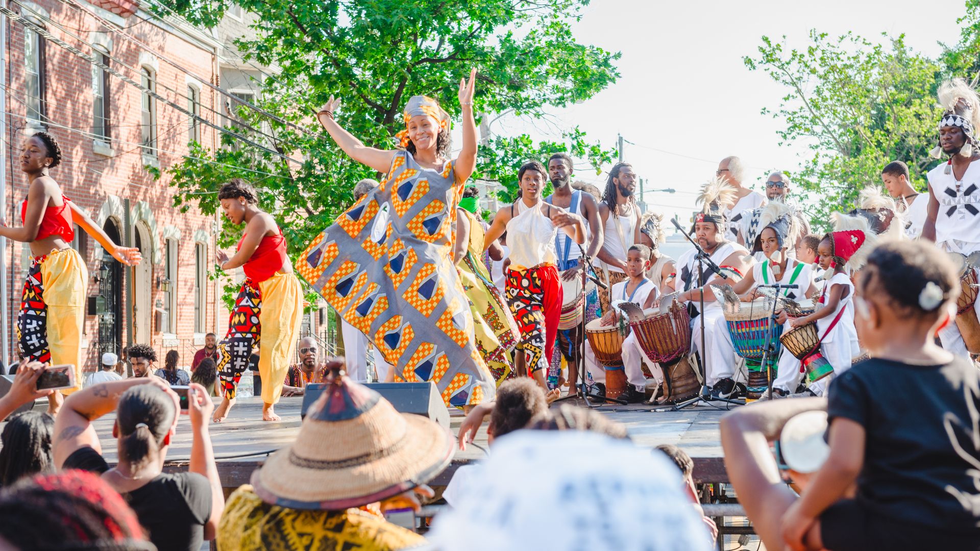 People dancing on stage during Philadelphia's Odunde Festival.