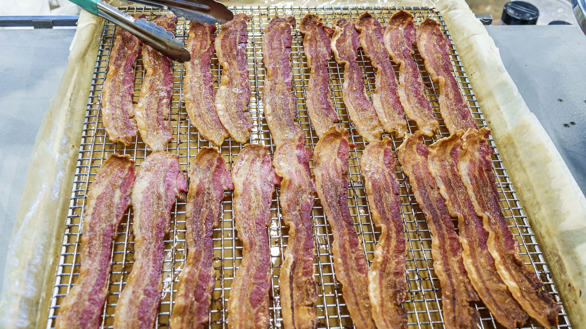 Bacon cooked on a tray.