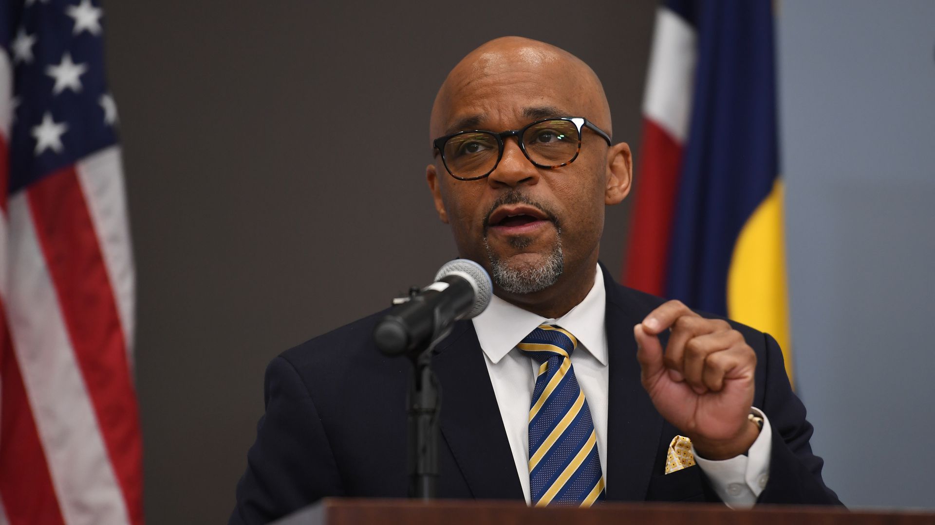 Mayor Michael Hancock stands at a podium