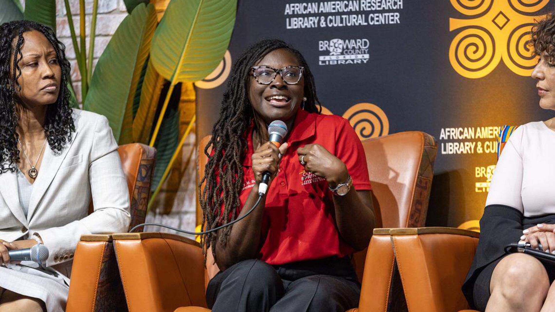 Nancy Metayer Bowen, center, speaks as ACLU of Florida Executive Director Bacardi L. Jackson, right, and President, Broward County Black Chamber of Commerce Shaheewa Jarrett Gelin, Esq., left, listen during a panel discussion at the African-American Cultural Research Center.