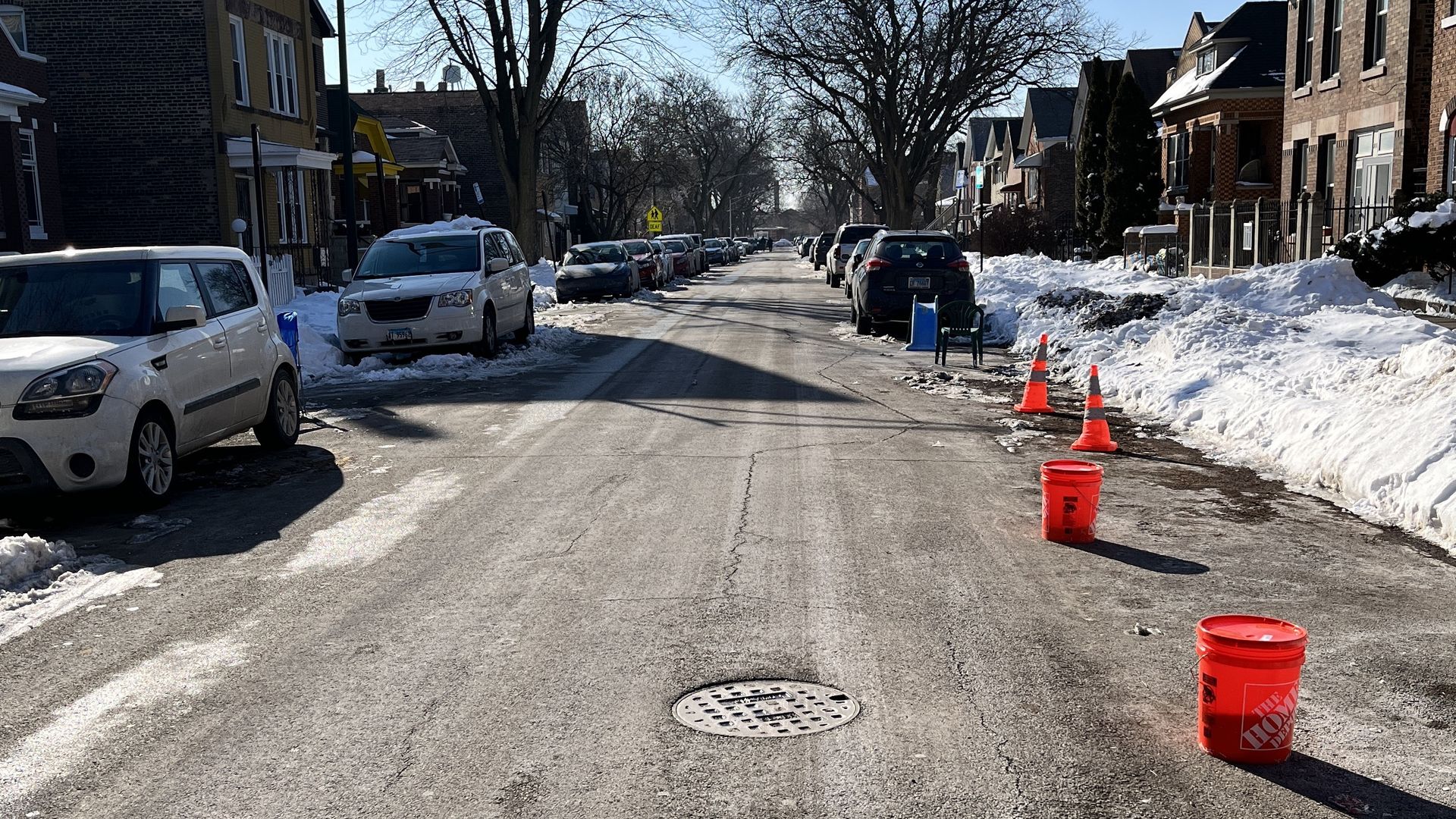Chicago street full of junk to call "dibs" on a street parking space