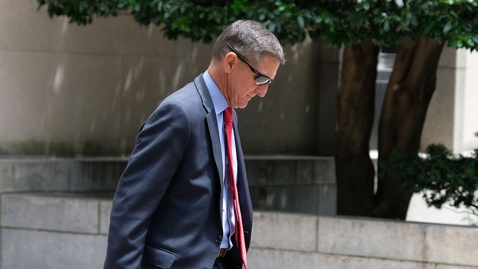Michael Flynn walking in front of a courthouse